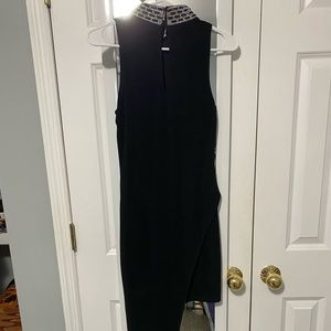 Black BEBE dress. Only worn once. Size:Small. Beautiful gems around collar.